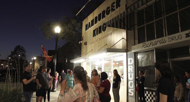 Oklahoma City Community College English Professor Jeff Provine leads the Haunted Downtown Shawnee tour for about 25 people on Oct. 11. Provine said Hamburger King is said to be haunted by its founder, Joseph Macsas, as well as its former owners who can be heard moving furntiture upstairs, since it was a furniture store. The Community Matters event was hosted by the Shawnee Public Library. Provine is also the author of "Haunted Shawnee OK," and he held a book signing at The Arts at 317 earlier that day.