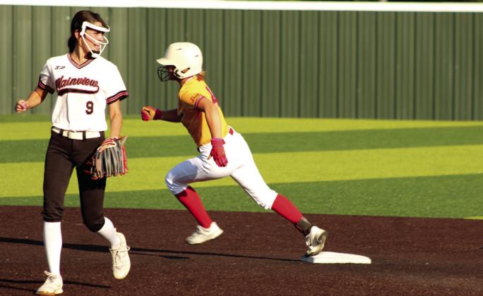 Dale senior Reese Herring rounds second base on her way to third after hitting a triple in the Dale Fast Pitch Festival game against Plainview on Sept. 11. Dale won this game, 10-1; lost to Silo, 1-2; won against Roff, 7-0; and beat Leedey, 1-0.