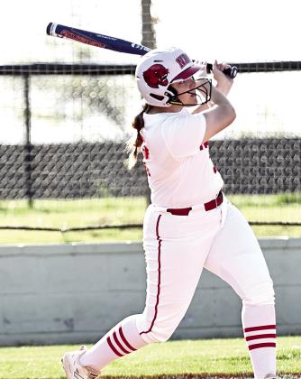 North Rock Creek's Morgan Bertram watches the ball go over the fence for a homerun. Photo courtesy of Gowin Photography