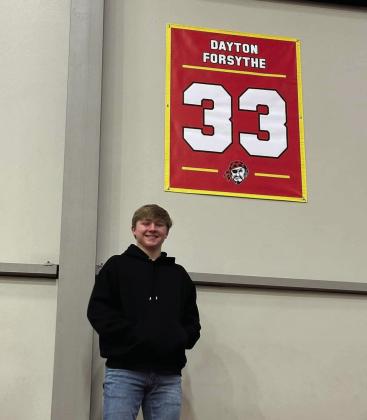 Dayton Forsythe poses below his retired number. Countywide &amp; Sun/Suzie Campbell