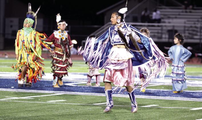 Members of the Wolf Spirit Dancers performed at halftime during Jim Thorpe Night at Shawnee High School, Sept. 27. They included, from left, Grass Dancer Samuel Wilson (Sac &amp; Fox), Jingle Dress Dancer Catrina Blanchard (Absentee Shawnee Tribe), Fancy Shawl Dancer Alivia Grass (Sac &amp; Fox), and Jingle Dress Dancer Prestynn Neely (Citizen Potawatomi Nation), said SPS Director of Communications Amanda Johnson.