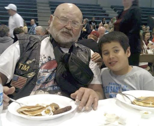 Vietnam Veteran Timothy Lawrence eats breakfast with his great-grandson Tyler at the Shawnee Kiwanis Pancake Day in 2012.