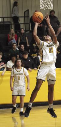 Tecumseh’s Sherman Mitchell goes to the hoop and sinks it in the fourth quarter.