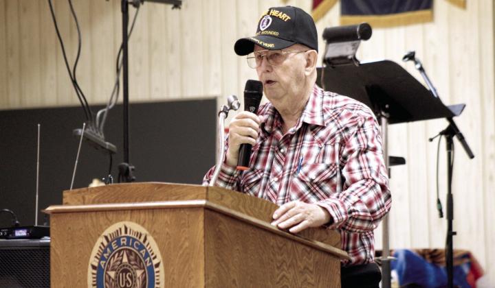 Vietnam Veteran Rea Sparks speaks about his war-time experiences during the Tecumseh American Legion Post 260 Memorial Day ceremony on May 25. Natasha Dunagan, Countywide &amp; Sun