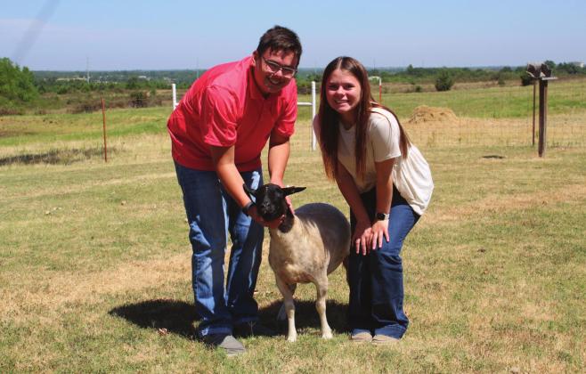 Siblings Cord and Cora Bender pose with Princess the Dorper hair sheep at their farm near Dale. The Benders both received their State FFA Degrees this year. Countywide &amp; Sun/Natasha Dunagan