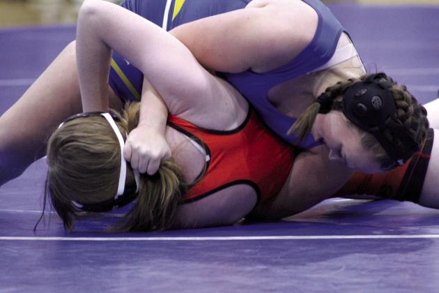 Bethel’s Bailey Murray flips Konawa’s Rhegan Aldredge using her ponytail and arm leverage during the wrestling meet on Jan. 25. Bethel also faced Prague for the Wrestling Homecoming and Senior Night meet. Countywide &amp; Sun/Natasha Dunagan