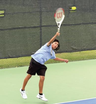 Tecumseh freshman Noah Mason serves in #2 Doubles at the Elk City Tennis Tournament on April 22. Along with doubles partner Jaxon McCullough, Mason placed sixth. The #1 Doubles team of Xzavier Kommer and Eli Mullins took seventh. Both Ted Belshe, in #1 Singles, and Christian Falcon, in #2 Singles, earned fifth place. The Savages tennis team also placed fifth. Photo courtesy of Jennifer McKnight