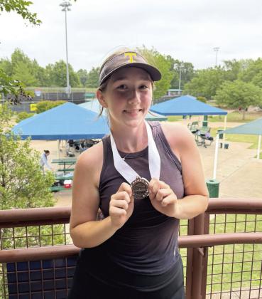 Tecumseh sophomore Kylie Britt poses with her third-place medal in #2 Singles from the Elk City Tennis Tournament on April 22. In #1 Singles, Kyann Sells placed second. The #1 Doubles team of Kalyn Bartmess and Maggie Johnson earned fourth place, and the #2 Doubles team of Hannah Tidwell and Savannah Wootten took third place. As a team, the Lady Savages achieved second place. Photos courtesy of Jennifer McKnight