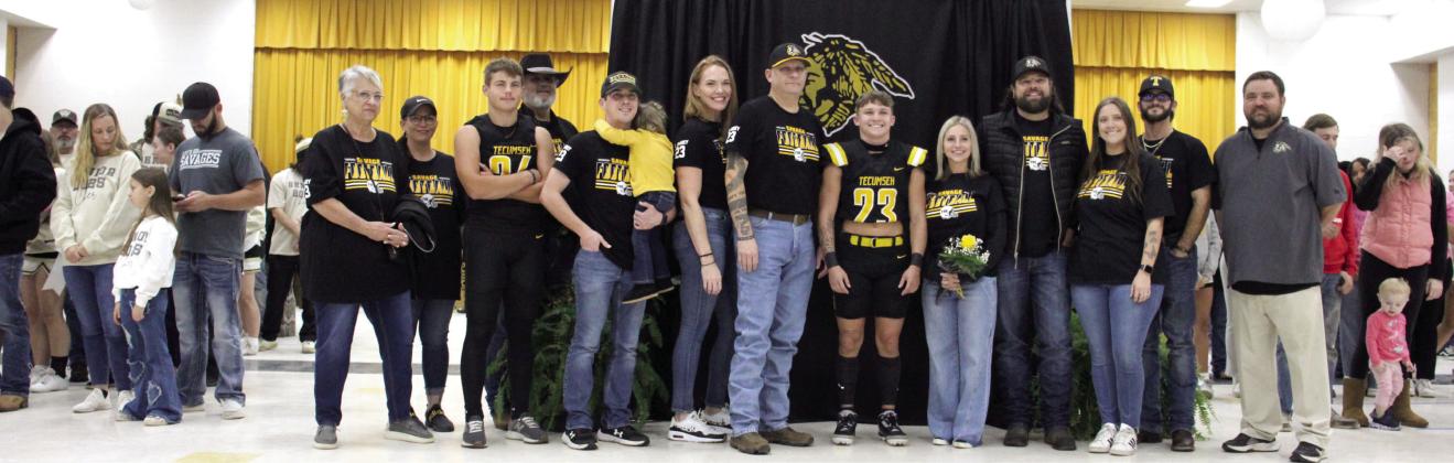 Tecumseh High School held their Senior Night ceremonies for football, cheer, band and cross country in the W.P. Wood/THS Alumni Center on Nov. 8, before the home football game. Shown are Zant Shirey (#23), his family, including his cousin sophomore Kruz Shirey (#24), and Head Football Coach Ty Bullock, far right. Photo provided by Tracey Forrester.