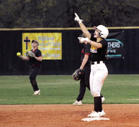 Tecumseh senior Taylor Gage claps and motions to her team after making a double during the Lady Savages' second home game of the evening, April 4. They won that game against Westmoore, 15-5, and with Latta, 6-4. Countywide &amp; Sun/Natasha Dunagan