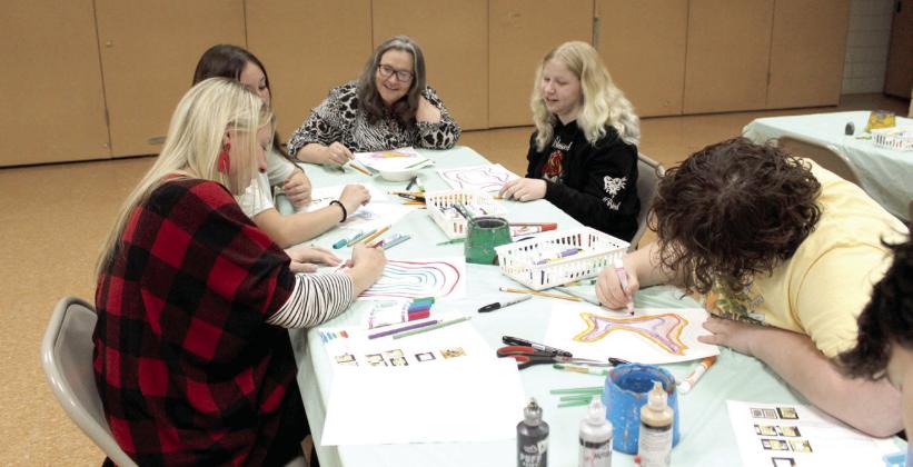 Attendees to the "Mixed Media Geode Drawings" class at Tecumseh Public Library work on their art pieces on June 23.
