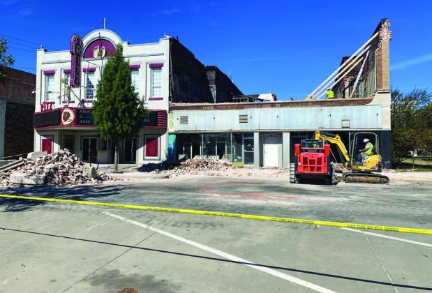 Crews attempt to clean up the mess and manage the safety concern from the building collapse on East Main.