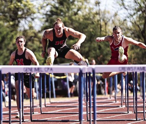 North Rock Creek’s Maddox Motley wins the 110m hurdles with Ethan Nowakowski. Photo courtesy of Gowin Photography
