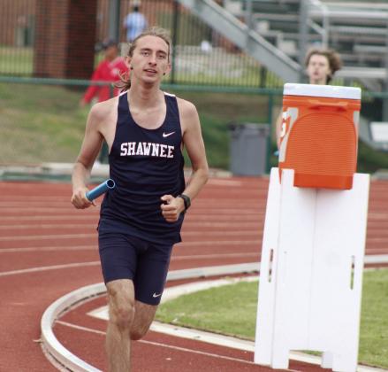 Shawnee’s Connor Brantley carries the baton in the 4x800 relay during the track and field meet held at OBU on April 9. Brantley and his teammates placed third in the event. Countywide &amp; Sun/Natasha Dunagan