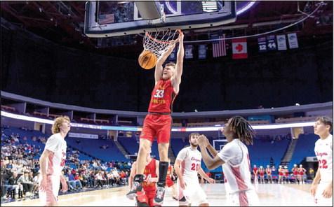 Dale junior Dayton Forsythe pulls down a basket in the second half of the Tournament of Champions final game against Tulsa Memorial on Dec. 30. Class 2A Dale is the first small school to bring back the championship since 1978. Photo provided.