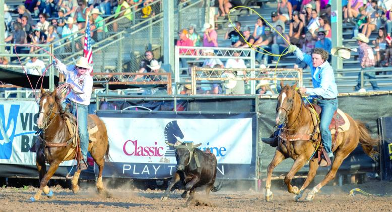 Landen and Hayden Youngblood, of Shawnee, work together in the team roping at their first International Finals Youth Rodeo on the evening of July 10. Photo courtesy of Richelle Treece.