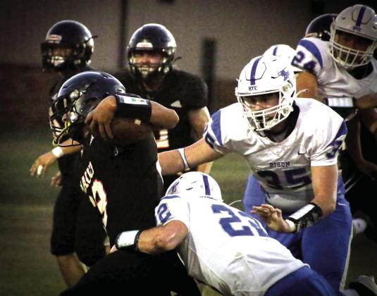 Maud sophomore Juliouz Brown makes the carry while being pulled down by a Bowlegs defender during the Maud home game on Oct. 10.