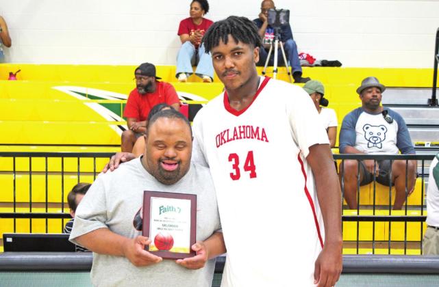 Lance Washington presents the OK MVP to Bradyn Hubbard.