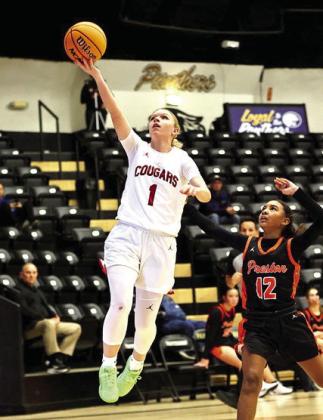 North Rock Creek's Addisen Lawrence goes up to add two points in the 63-- 31winagainstPrestoninthefirstroundoftheOkemahtournamentonDec.11.