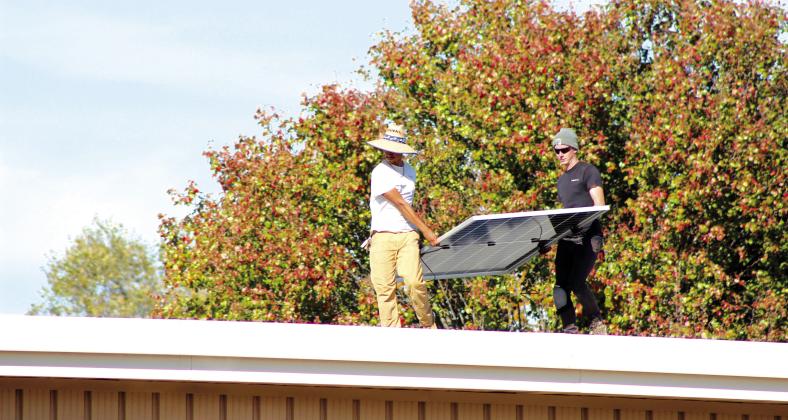 The crew of EightTwenty Solar work on installing 42 solar panels on the Earlsboro Elementary School building on Nov. 6. Principal Stacey Barton said he worked with OG&amp;E through the CLEAResult Program to make this happen. They were on a waiting list for the past five years. Countywide &amp; Sun/Natasha Dunagan