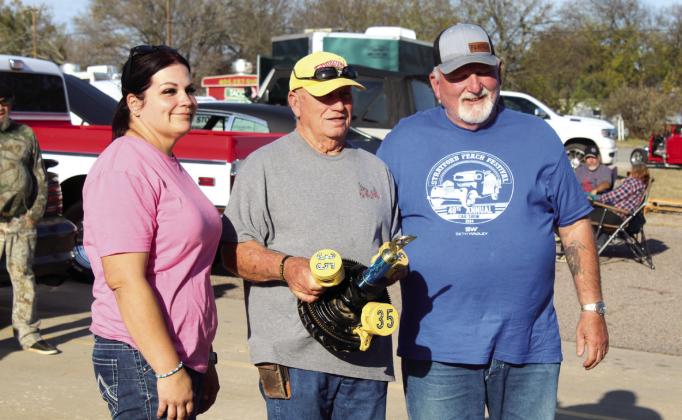Southern Paws Rescue, Inc., Founder &amp; Director Michelle Oakley, far left, and Asher Mayor Wesley Culwell, far right, present the Mayor’s Choice trophy to Jim Sparks, of Shawnee, for his 1934 Ford Coupe.