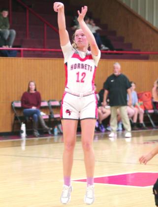 Macomb's Addy Beauchamp launches a three-pointer during the first quarter of the Jan. 16 home game against Strother. Phottos by Natasha Dunagan, Countywide &amp;amp; Sun