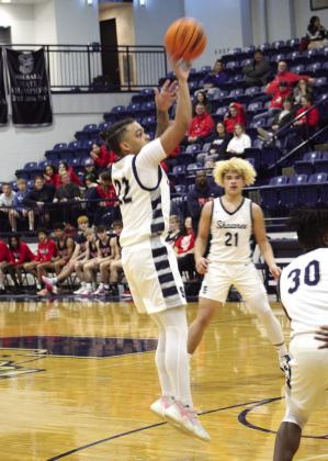 Shawnee’s Jalen Wicks makes his jump shot in the fourth quarter of the home game against Ponca City on Dec. 16.