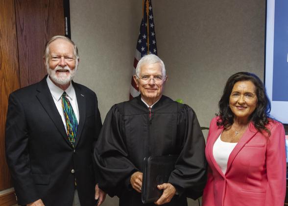 Barry Tims (left) and Mona Adkisson (right) were sworn in at the July 17 meeting of the SSC Board of Regents. Former District Judge George Butner (center) administered the Oath of Office. Photo Provided