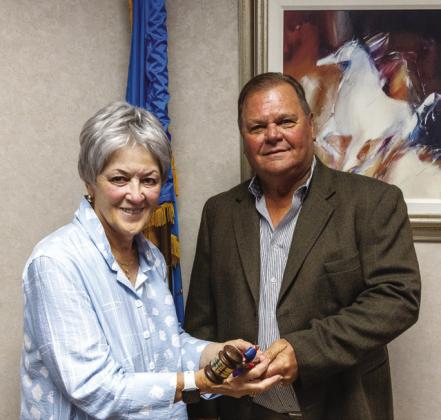 Regent Curtis Morgan (right), who served as Chair of the SSC Board of Regents for the 2024-2025 academic year, passes the gavel to the newly elected 2025-2026 Chair Marci Donaho (left).