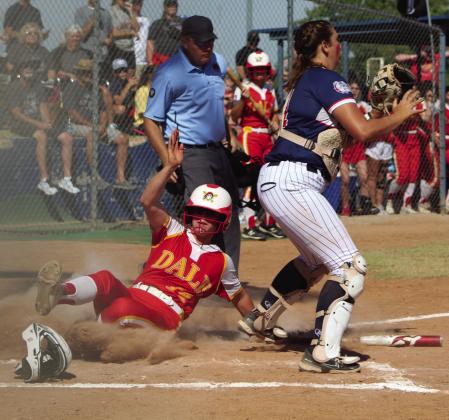 Dale junior Karsen Griggs slides into home, as the Minco catcher waits for the throw, during the third inning of the State Quarterfinal game on Oct. 6 at the USA Softball Hall of Fame Stadium in OKC. The Lady Pirates played a hard-fought game the whole seven innings and won, 3-2. They went on to the Semifinals with Pocola, but lost 2-6.