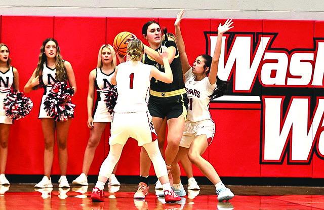 Addisen Lawrence and Hailey Anglin put pressure on the Broken Bow player, but North Rock Creek fell short in the semi-final game of the Washington Tournament,losing to Broken Bow 36-65.