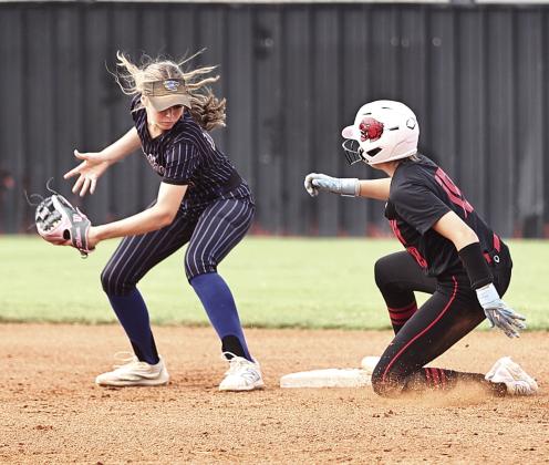 North Rock Creek's Sophie Morris beats the throw at 2nd against Bethel in the McLoud Tournament on Sept. 5. NRC beat Stroud 13-1 and Bethel 6-3 to advance to the gold bracket.