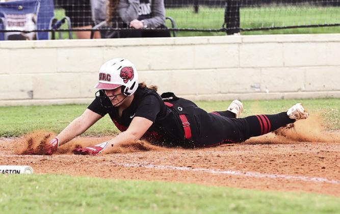 North Rock Creek's Morgan Bertram slides safely home to score against Stroud in the McLoud Tournament on Sept. 5.