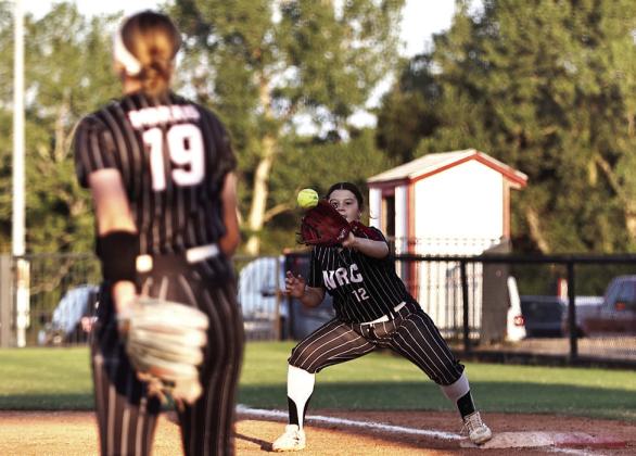 North Rock Creek's Sophie Morris, throws the ball to Presley Rosser at 1st for the out.