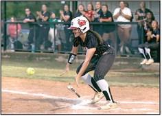 Jaden Clifton puts down a perfect bunt for North Rock Creek. The softball team played in the McLoud softball tournament for the gold bracket.