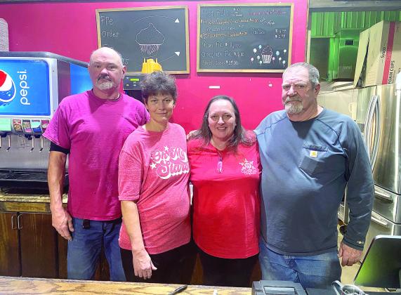 Tim and Tammy Carmichael (pictured left) stop for a photo with former owners of Cope’s Country Cafe Melissa and Pat Cope. The Carmichael’s did not want to see the business that Tammy’s family members worked so hard to build close its doors so Tammy decided to embrace the opportunity and continue the family business. Countywide &amp; Sun/Julie Talton