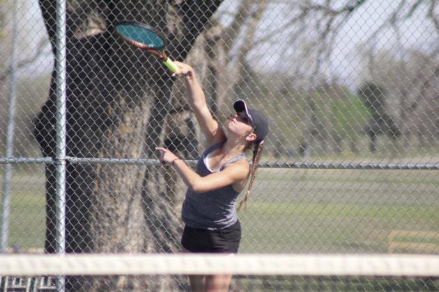 Tecumseh junior Kyann Sells serves during the Tecumseh Tennis Tournament, which included eight teams on March 31. Natasha Dunagan, Countywide &amp; Sun