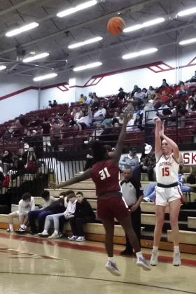 McLoud senior Gracie Little puts up a three-pointer in the Class 4A District home game with Byng on Feb. 22. The Lady Redskins won, 74-30, and they will play in the regional tournament at home today (Feb. 27), beginning at 6 pm.