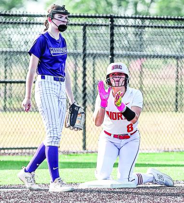Aubree Shivelhood slides safely into third base in the Aug. 17 game.