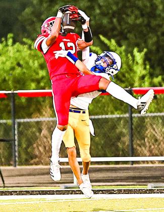 NRC Freshman Ace Hawkins jumps high for the interception against Bethel in the Aug. 20 scrimmage.