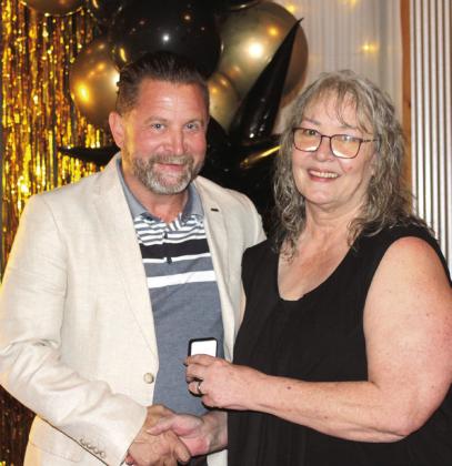 Michael Affentranger (left) receives his Pottawatomie Power Top 10 lapel pin from Countywide &amp;amp; Sun Owner and Publisher Suzie Campbell. Natasha Dunagan, Countywide &amp; Sun