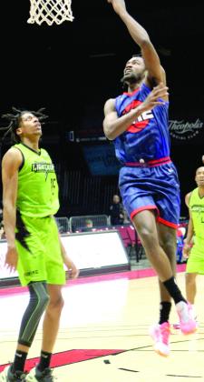 Potawatomi Fire Guard &amp; Forward Theo Johnson puts up a shot in the fourth quarter of the home game with the Little Rock Lightning on March 25. The Fire won, 122-96. Countywide &amp;amp; Sun/Natasha Dunagan