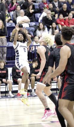 Shawnee senior Daytain Patton tries for three points in the Feb. 8 home game with North Rock Creek. Patton was also recognized that night for reaching 1,000 career points during the Guthrie away game on Feb. 4. Countywide &amp;amp; Sun/Natasha Dunagan
