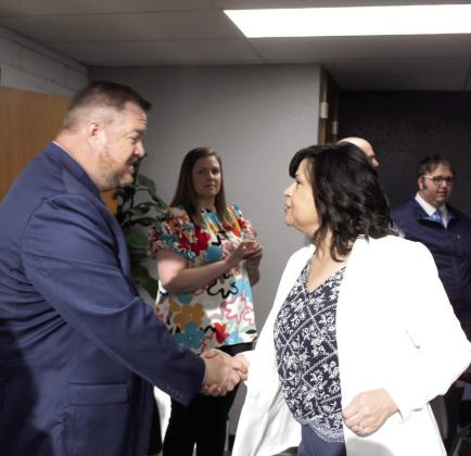Shawnee Early Childhood Center Principal Karen Watkins shakes hands with new Shawnee Public Schools Superintendent Dr. Jason James during a meet-and-greet. Natasha Dunagan, Countywide &amp; Sun
