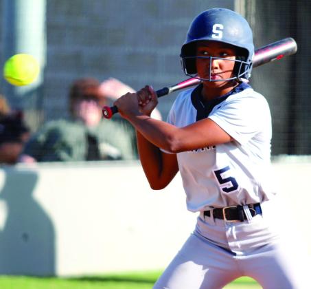 Shawnee’s Amiyah Briones keeps her eye on the ball before hitting a single in the second inning of the home game with Seminole on Oct. 1. The Lady Wolves Fast-Pitch team won, 12-0. Countywide &amp; Sun/Natasha Dunagan