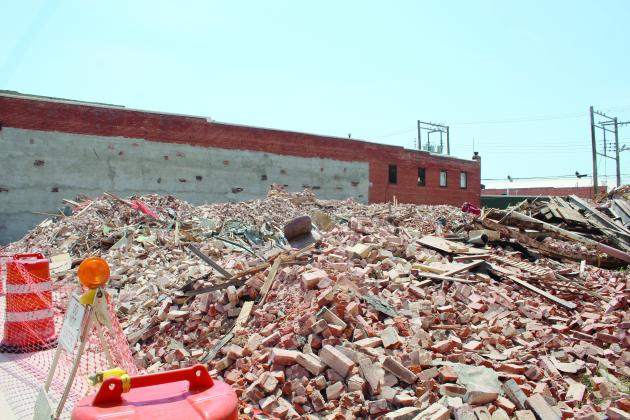 An office chair remains in the rubble which was once Pott. County Book &amp; Office Supply at 109 E. Main in Shawnee. The building had its western wall blown out during the April 19 tornadoes. Then, its roof collapsed on July 3, and after closing that block, the city demolished the 116-year-old former Kress’s building on July 21. Pott. County Book &amp; Office Supply had been in the building since 1983, and owner Terry Webb said, at this time, he doubts they will rebuild. Countywide &amp; Sun/Natasha Dunagan