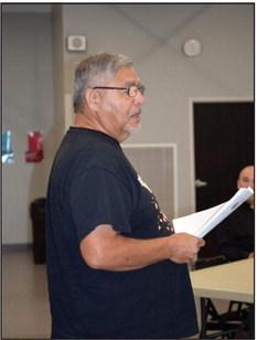 Victor Cope passes out a publication titled “Civil Rights and the Impact of Native American Names, Symbols and Imagery in School Mascots.” Countywide &amp;amp; Sun/Julie Talton
