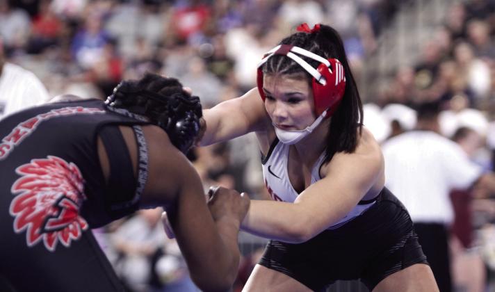 McLoud's Kendra Perrien stares down her opponent before winning in the 145 weight class.