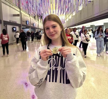 Shawnee senior Senior Mia Bryant shows off her hardware. Photo provided by SPS