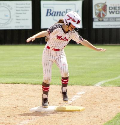 McLoud freshman Kayleigh Smith celebrates making it onto first base during the April 29 Class 5A Slow Pitch Regional Tournament game.